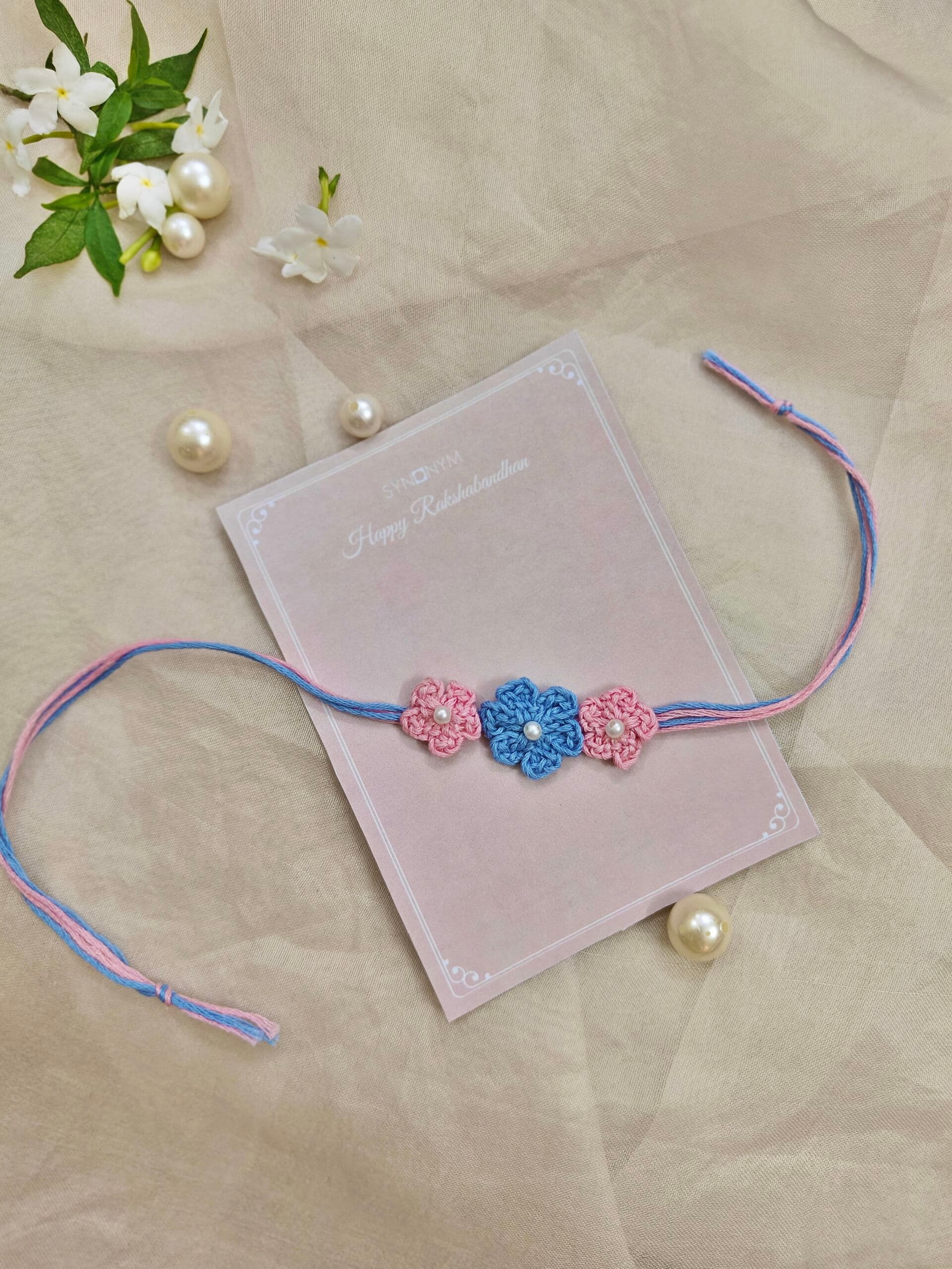Crochet Rakhi in pink & blue | Synonym Clothing Crochet Rakhi in pink & blue | Synonym Clothing